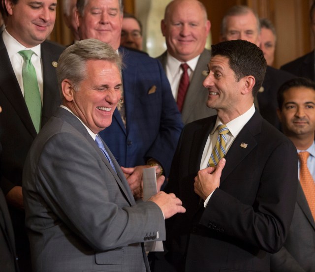 House Majority Leader Kevin McCarthy and Speaker of the House Paul Ryan congratulate each other on passing the Tax Cuts and Jobs Act in the House of Representatives.  - Credit:  CNP/SIPA USA/PA Images