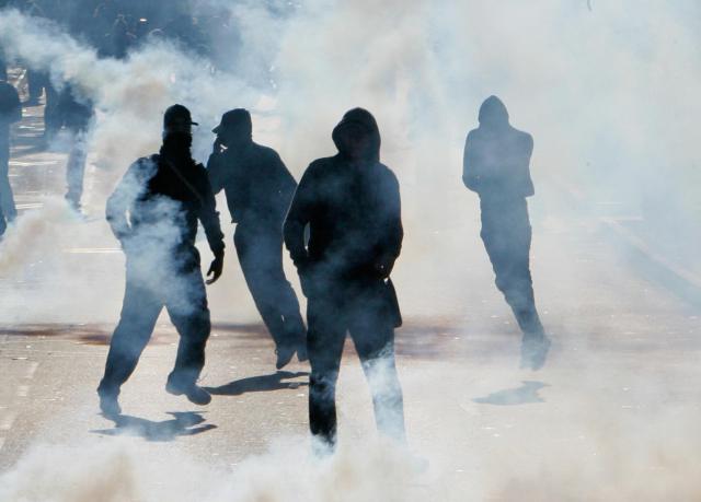 Youths rioting in a western Paris suburb. Credit:  Franck Prevel / Getty