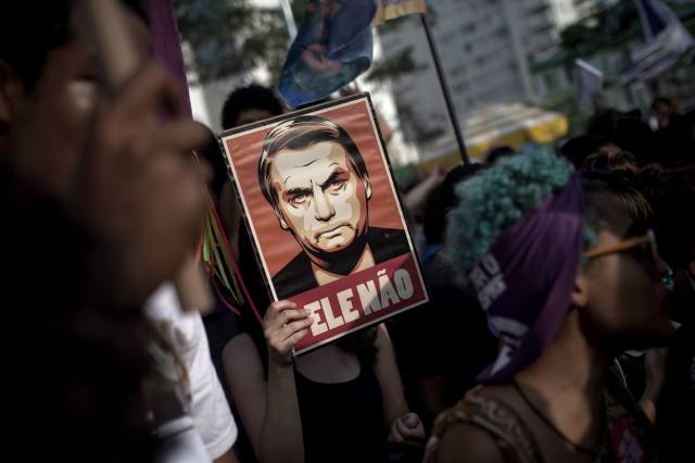 Despite the protests against Jair Bolsonaro, the far right’s presidential candidate, polls suggest he will win in Brazil on Sunday. Credit: Victor Moriyama / Getty