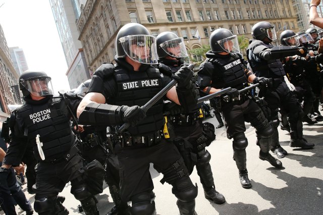 "Moderation is rapidly disappearing in political life, with dangerous consequences for the American republic." Police at a free-speech march in Boston. Credit: Spencer Platt / Getty