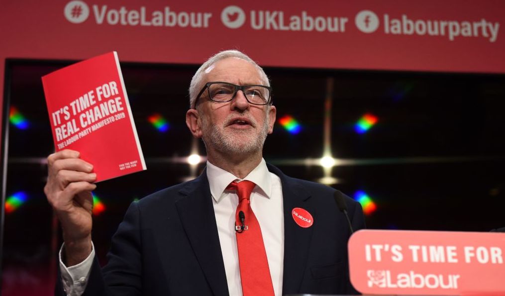 Jeremy Corbyn holds a copy of the party's manifesto. Credit: Getty
