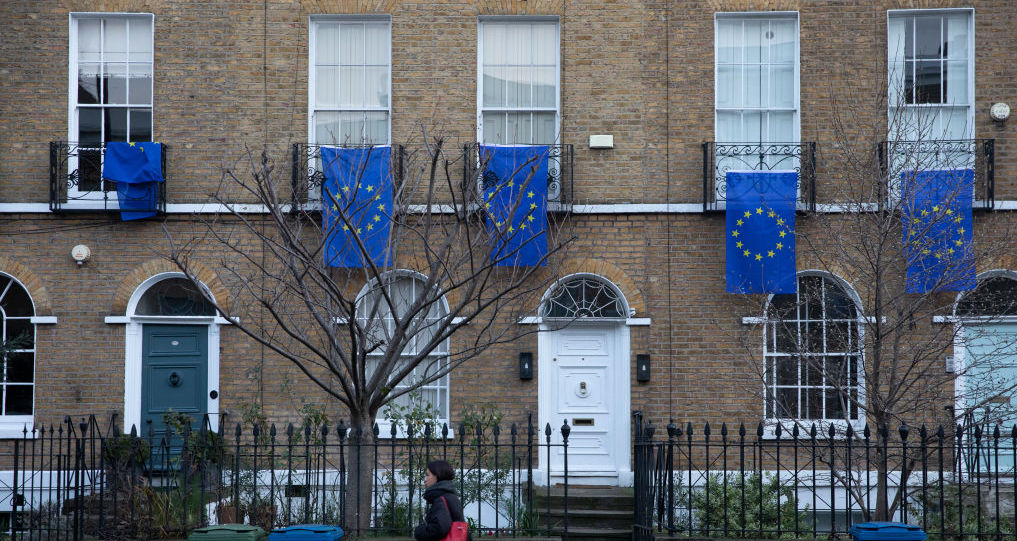 A woman walks past EU flags in Southwark. Credit: Getty Images