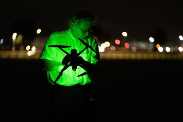An environment protester prepares to fly a drone near Heathrow Airport in an attempt to close the airport. (Photo by Lexie Harrison-Cripps/SOPA Images/LightRocket via Getty Images)