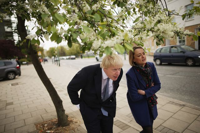 Boris Johnson ducks below tree branches while being interviewed by the BBC's  Laura Kuenssberg (Photo by Chip Somodevilla/Getty Images)