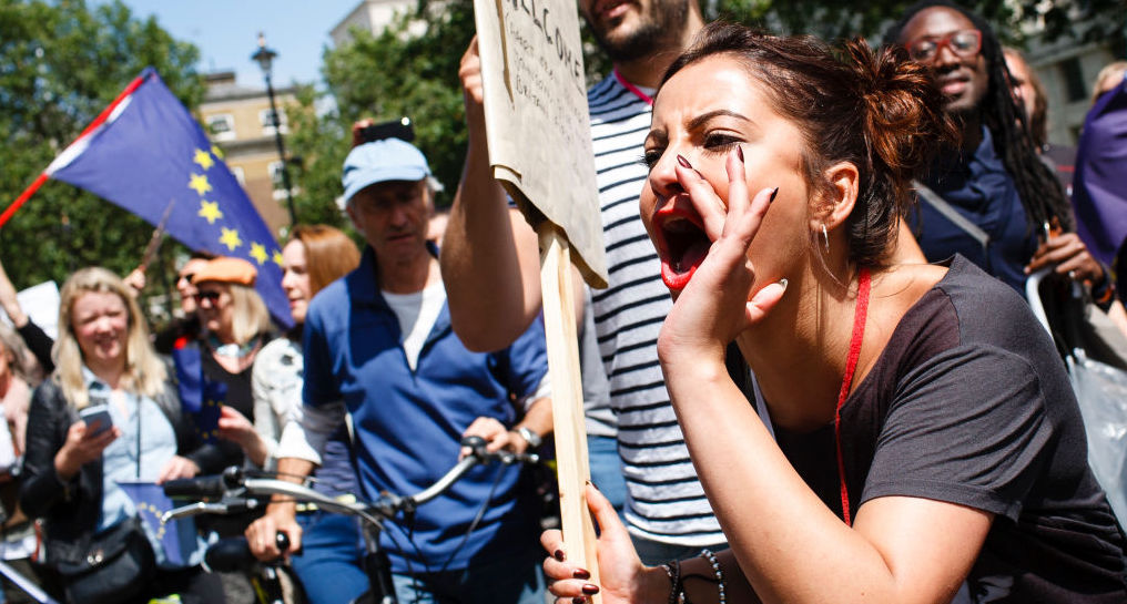 A demonstrator on Whitehall shouts towards Downing Street during the pro-EU "March for Europe". (Photo by David Cliff/SOPA Images/LightRocket via Getty Images)