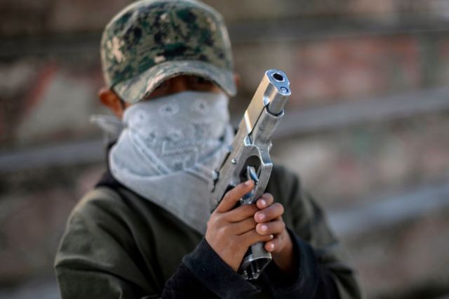 Children are taught to protect themselves from drug-related criminal groups in Mexico. Credit:  PEDRO PARDO/AFP/Getty