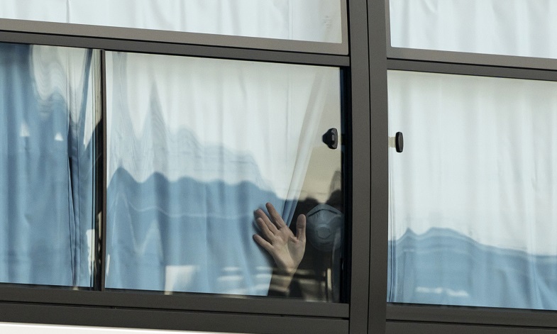 A man stares out his window during lockdown. Credit: Getty