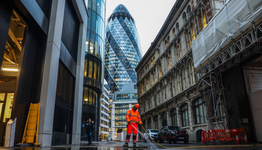 A worker is cleaning a street in The City. Credit: Zawrzel, Getty