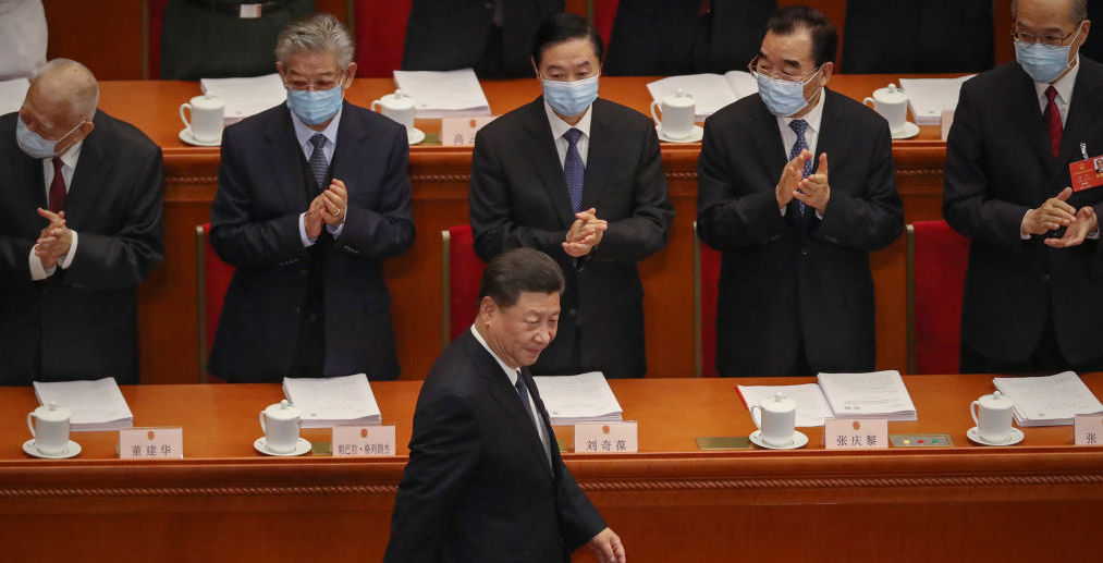 Xi Jinping is applauded as he arrives at the National People's Congress. Credit: Kevin Frayer/Getty Images