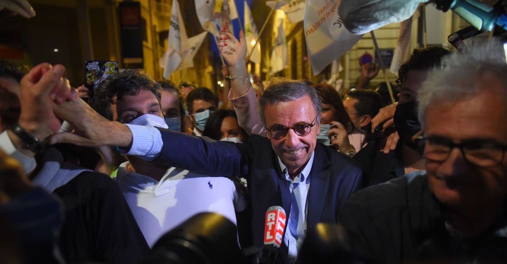 EELV candidate for Bordeaux mayor Pierre Hurmic (C,R) celebrates his win in Bordeaux. Credit Getty
