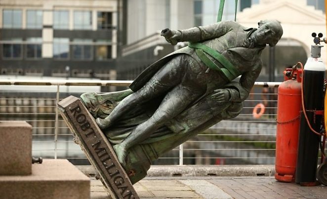 A statue of the slave owner Robert Milligan being removed from outside the Museum of London Docklands