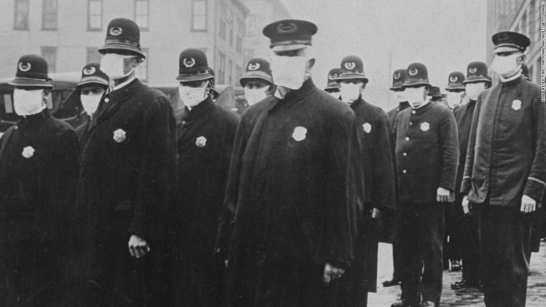 Seattle policemen wearing protective gauze face masks during influenza epidemic of 1918. Credit: Getty