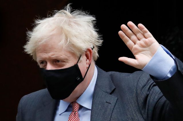 Boris Johnson leaves No 10 to attend PMQs (Photo by TOLGA AKMEN/AFP via Getty Images)