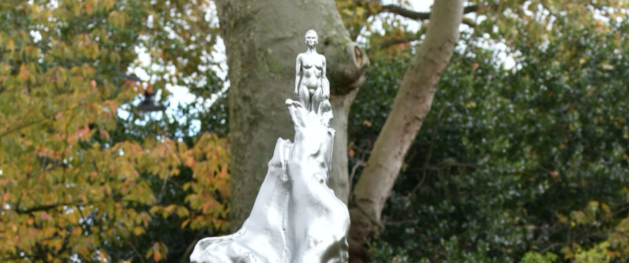 A gym-bodied piece of symbolism balanced on a silver plume