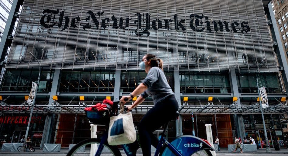 Does this woman on a bicycle hate the UK as much as the New York Times does. Credit: Getty 