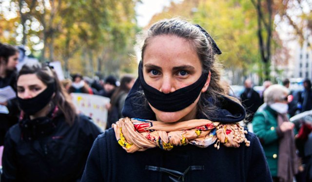 A gagged woman protesting in Madrid (Photo by Marcos del Mazo/LightRocket via Getty Images)