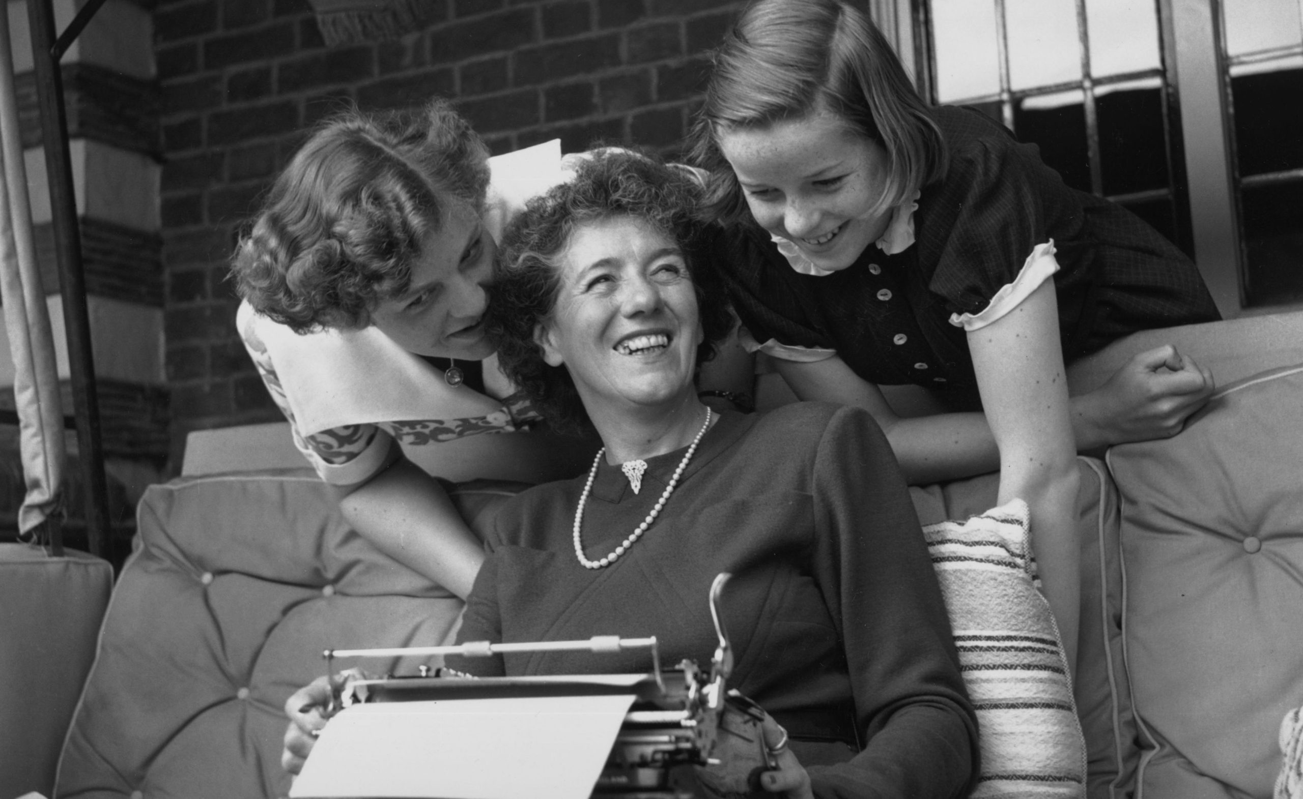 Enid Blyton with her two daughters Gillian (left) and Imogen (right) at their home in Beaconsfield. Credit: Getty