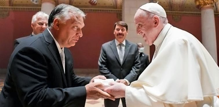 Pope Francis exchanges gifts with Hungarian Prime Minister Viktor Orban in Budapest.