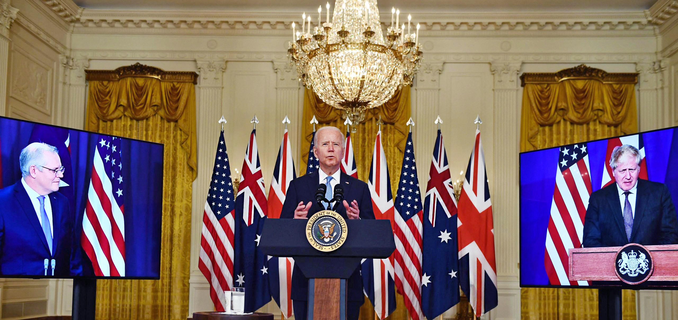 Joe Biden (c) with Boris Johnson (R) and Scott Morrison (L). Credit: Getty