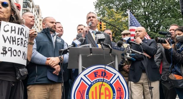Andrew Ansbro, president of the Uniformed Firefighters Association, speaks as city workers protest against the vaccination mandate.