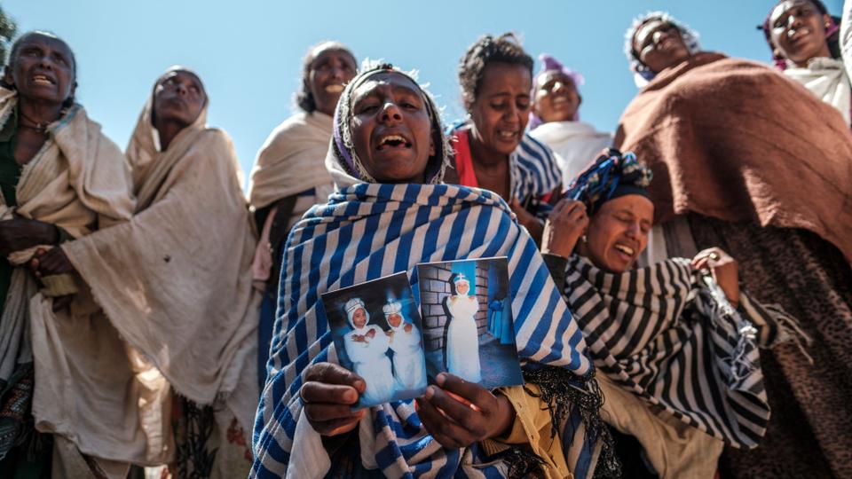 Women mourn the victims of a massacre by Eritrean Soldiers in Dengolat, the capital of Tigray