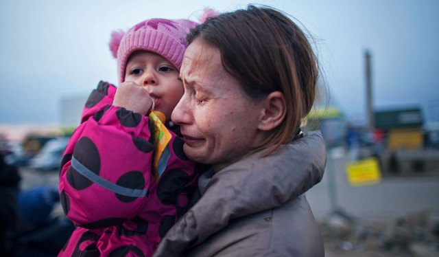 Mothers carrying children over borders is only part of the story. Credit: Maciej Luczniewski/NurPhoto via Getty Images