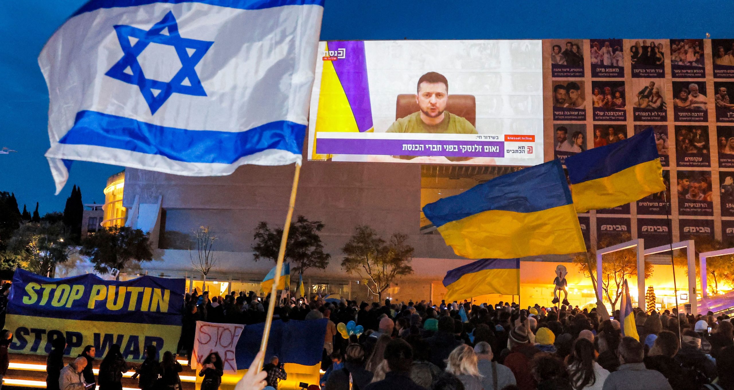 Demonstrators in Tel Aviv attend a televised video address by Volodymyr Zelensky. Credit: Getty