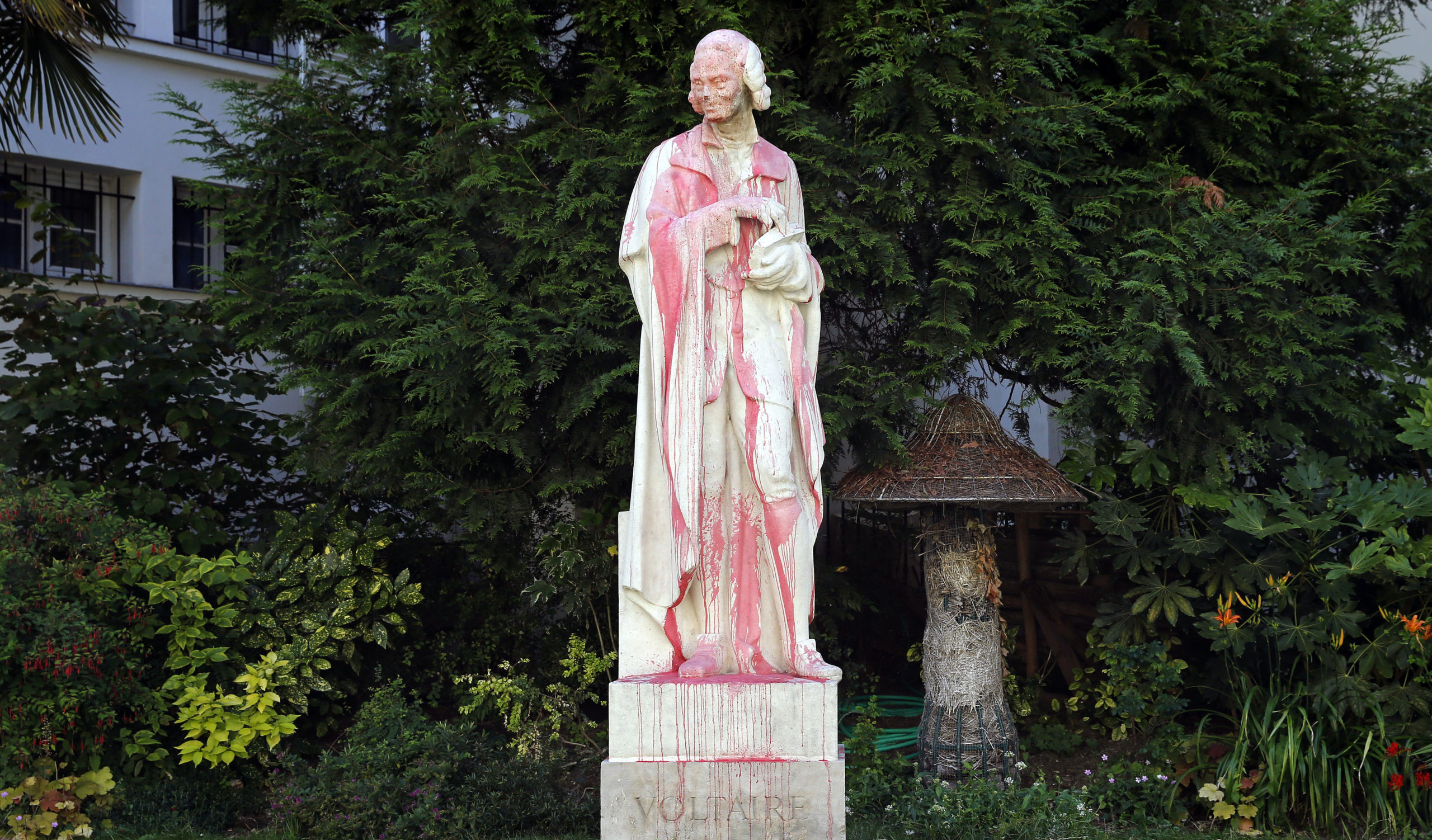The defaced Voltaire statue in Paris. Credit: Getty