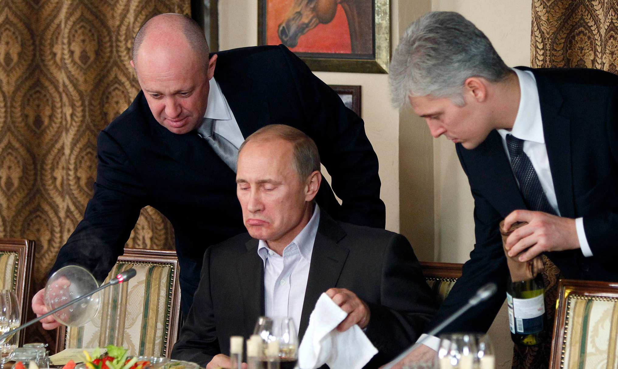 Prigozhin (l) and Putin. Credit: Reuters