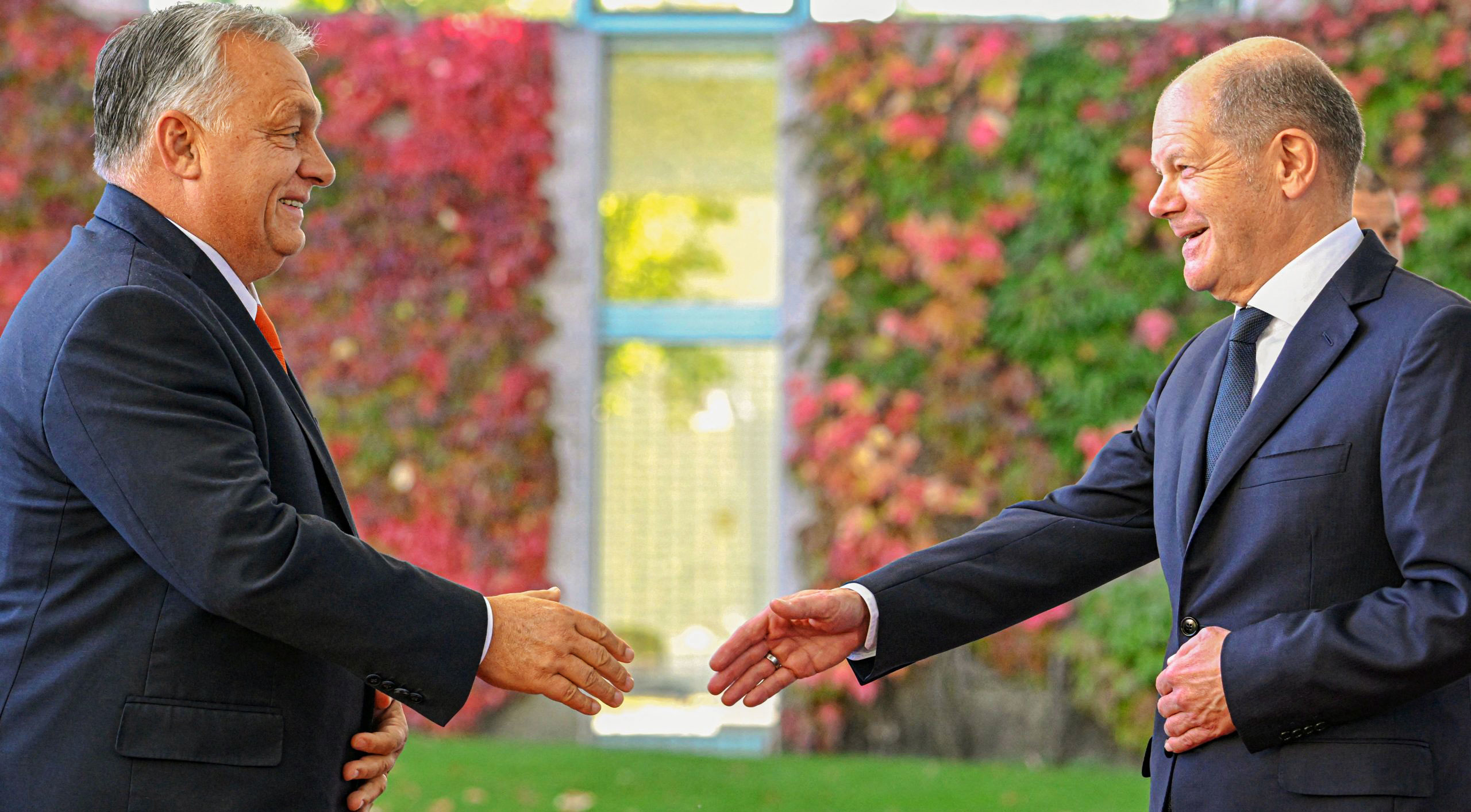 Olaf Scholz greets Viktor Orbán in Berlin last year. Credit: Getty. 