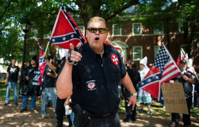 A member of the KKK shouts at protestors (ANDREW CABALLERO-REYNOLDS/AFP via Getty Images)