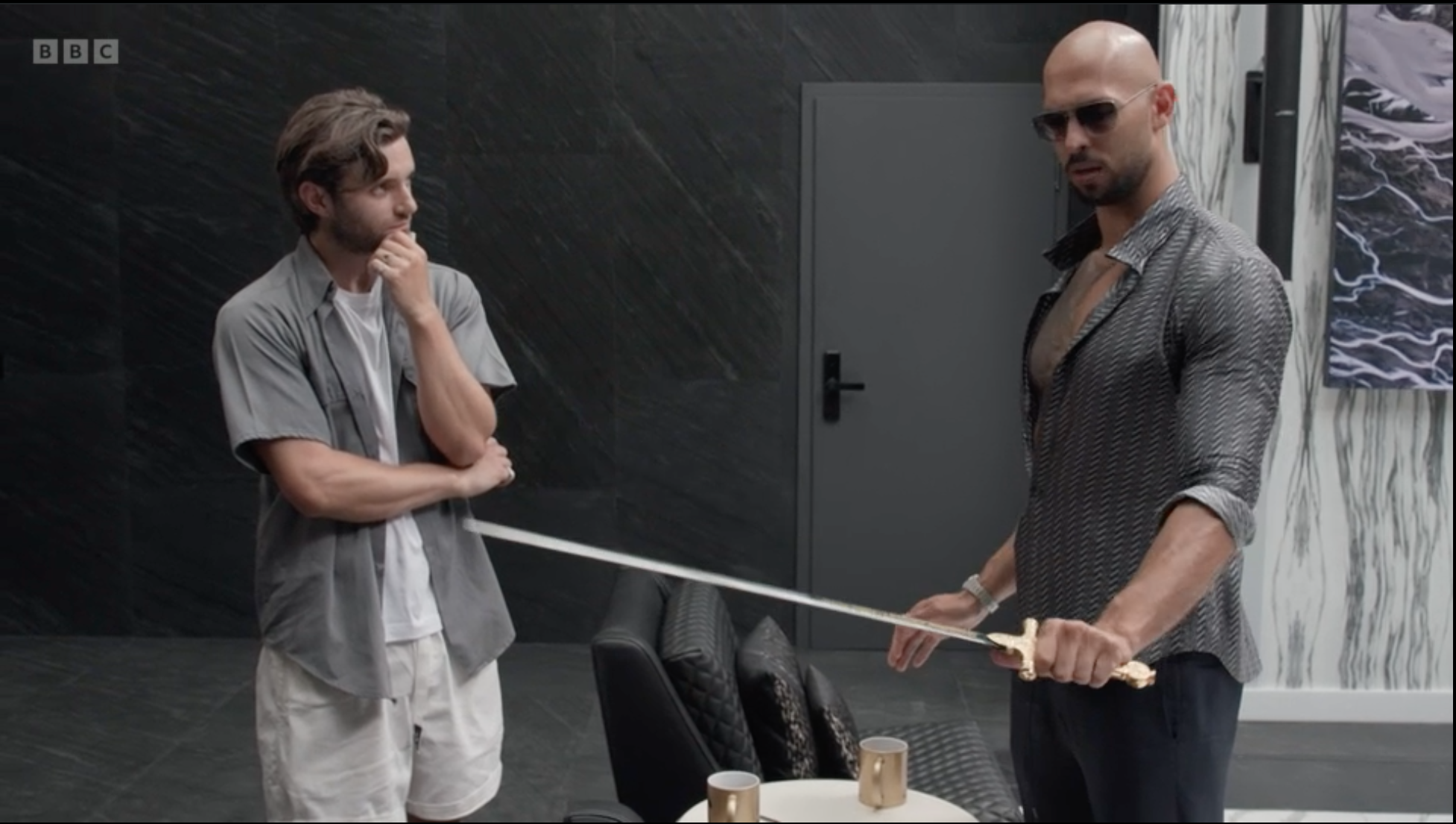 Andrew Tate shows Vice's Matt Shea his sword collection. Aha! Source: BBC.