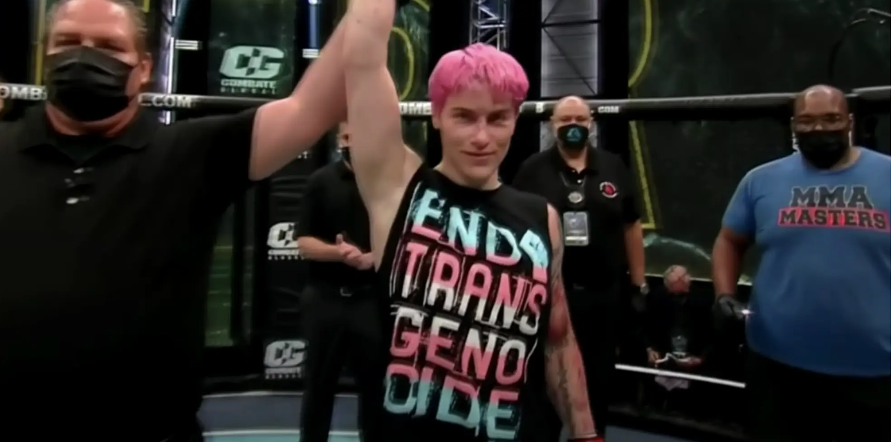 Transgender MMA fighter Alana McLaughlin wearing a top with the words 'End trans genocide'