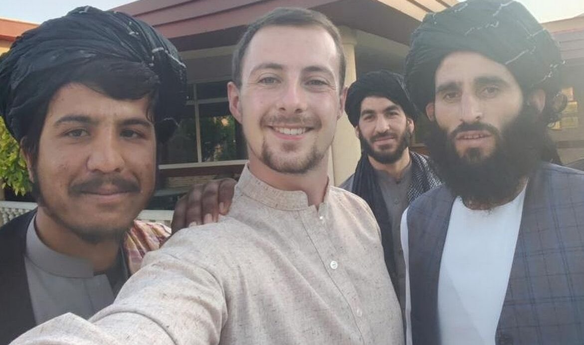 Miles Routledge poses with Taliban members. Credit: Lord Miles/Twitter