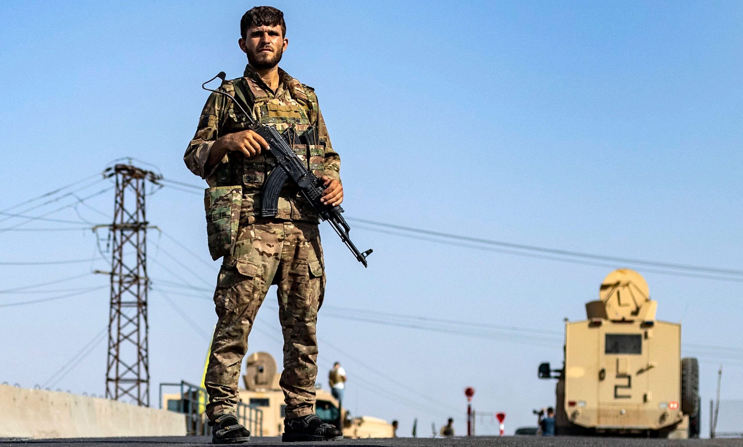 An SDF fighter stands guard in Syria's Deir ez-Zor province this week. Credit: Getty