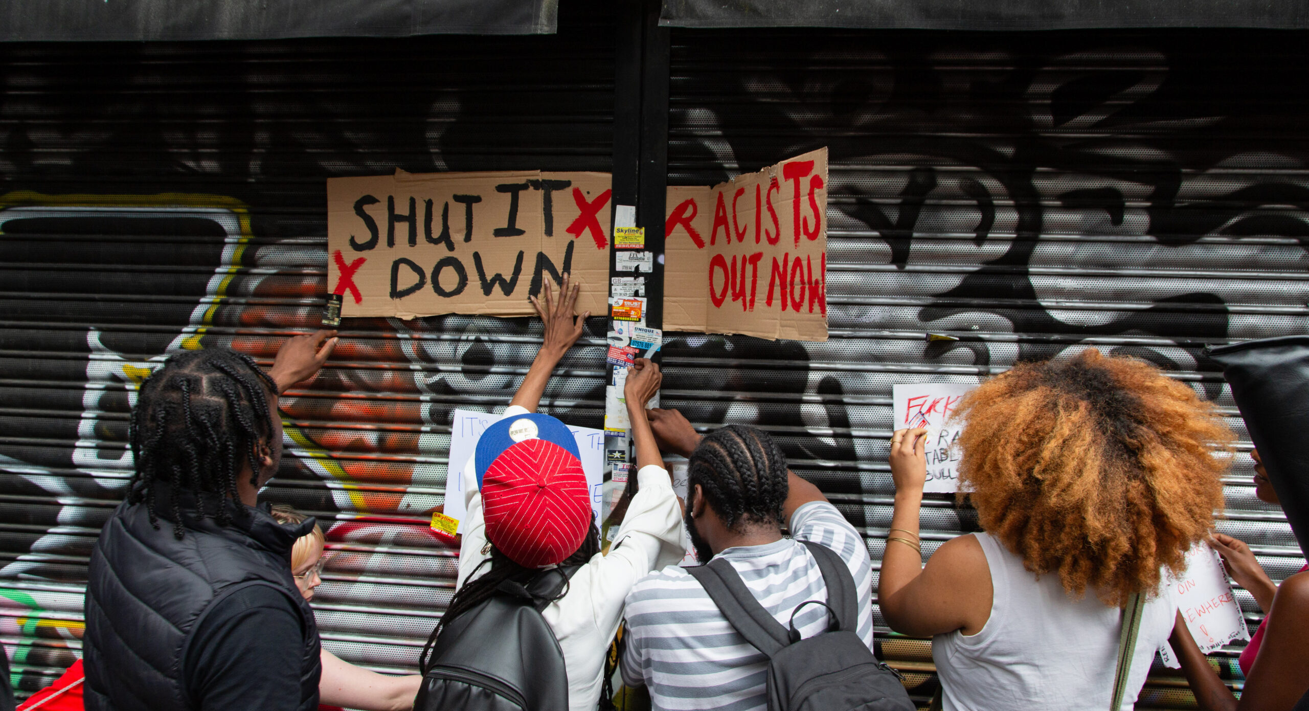 Protesters outside Peckham Hair and Cosmetics shop yesterday. Credit: Getty 