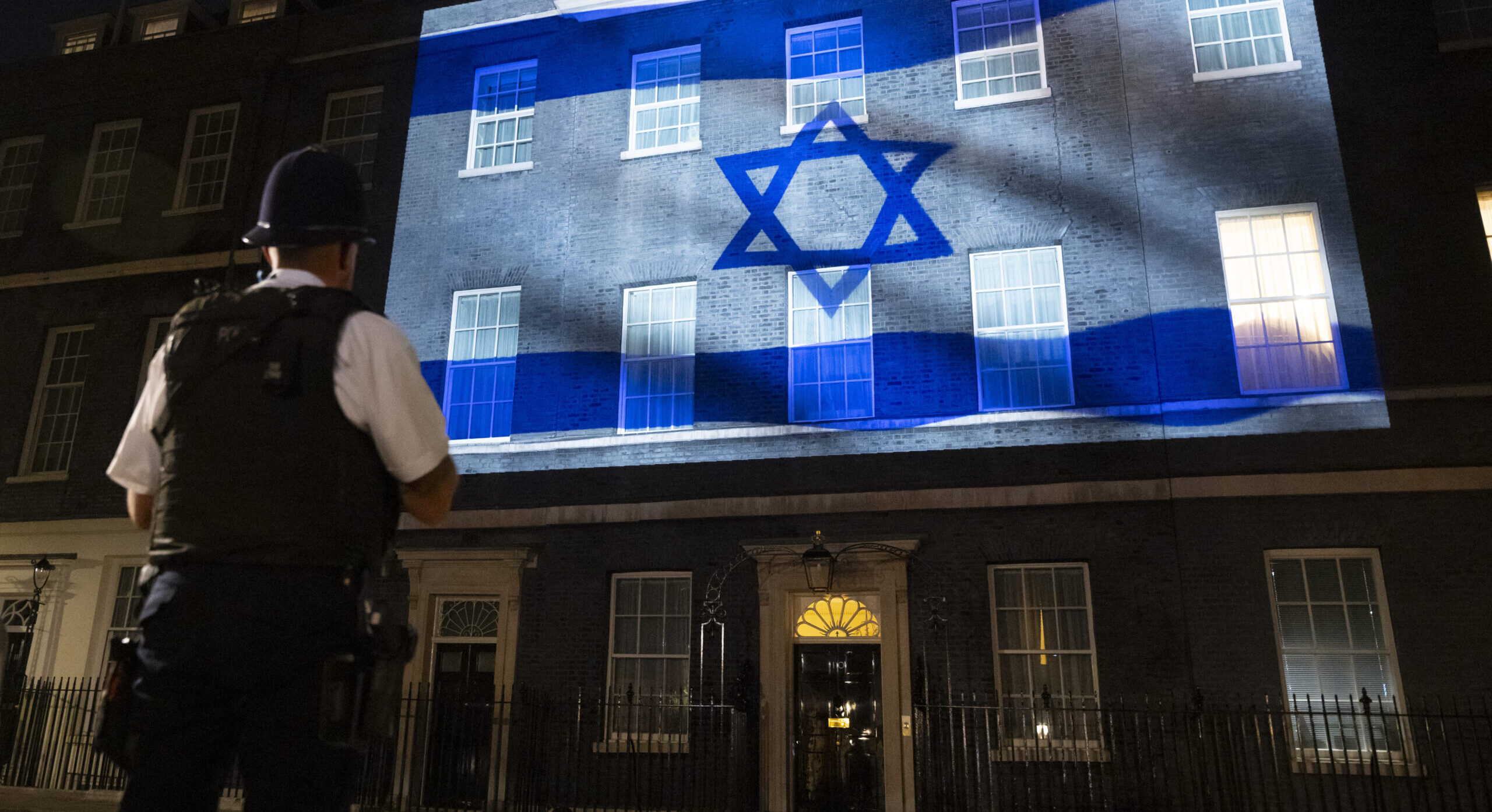 The Israeli flag has been projected onto Downing Street — but things are trickier in Whitehall. Credit: Getty
