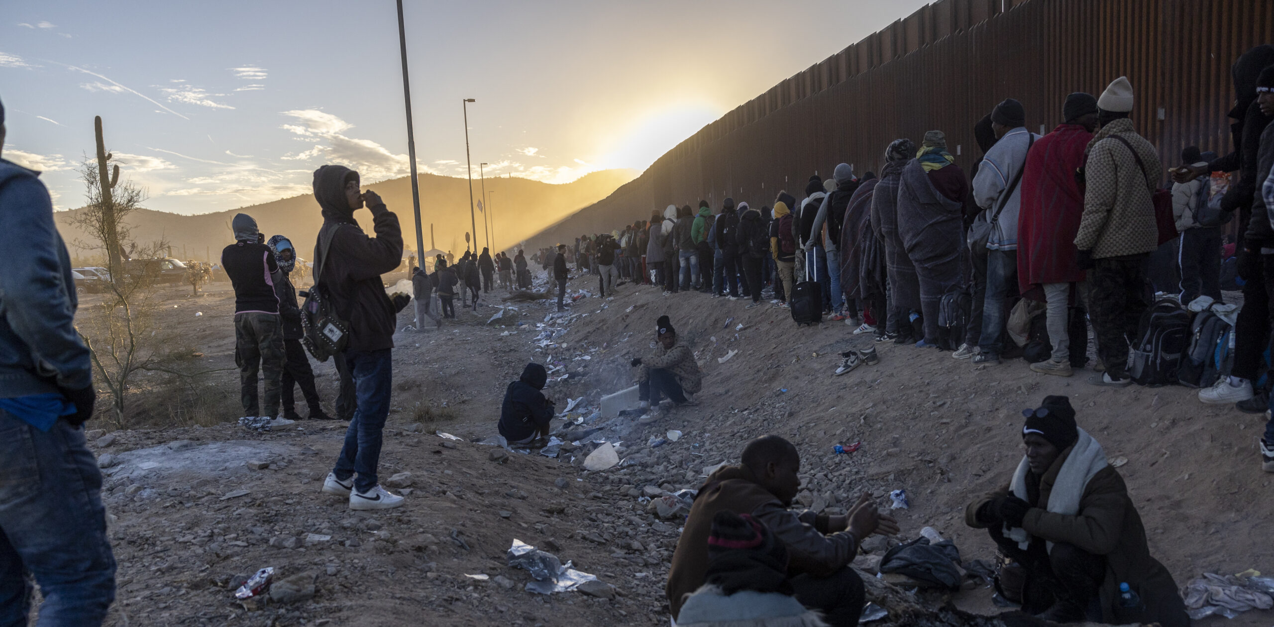 Immigrants waiting at the US-Mexico border, near Arizona. Credit: Getty