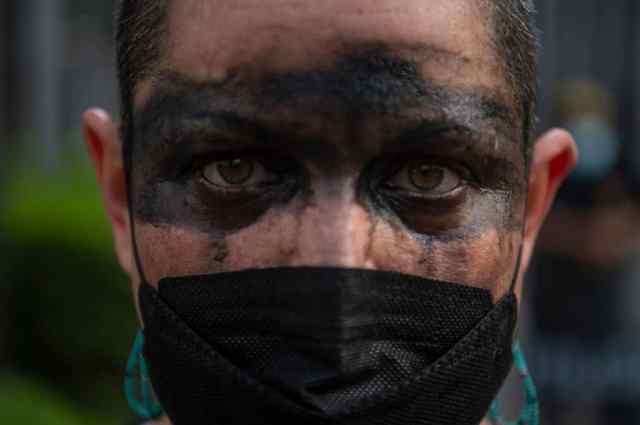 A demonstration against the Spanish oil company Repsol in Lima (ERNESTO BENAVIDES/AFP via Getty Images)