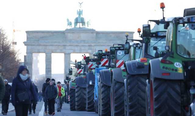 Farmers protest in Berlin near the Brandenburg Gate on Monday. Credit: Getty