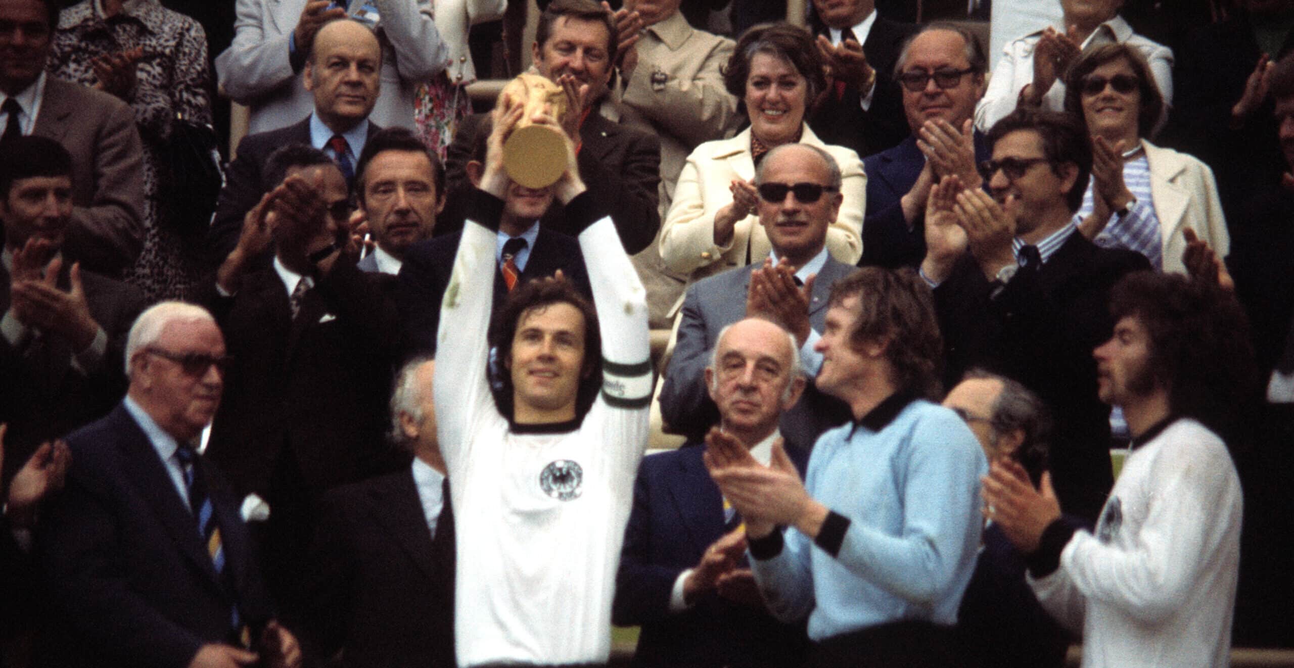 Franz Beckenbauer lifts the 1974 World Cup trophy as West Germany captain. Credit: Getty