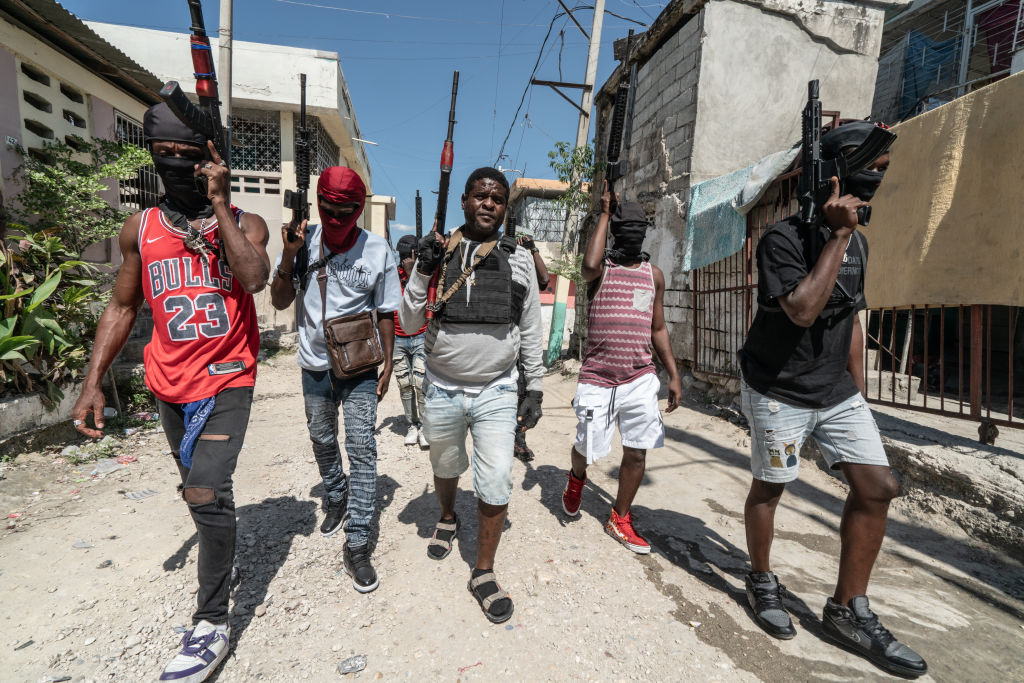 Gang Leader Jimmy 'Barbecue' Cherizier with G-9 federation gang members in Port-au-Prince. Credit: Getty