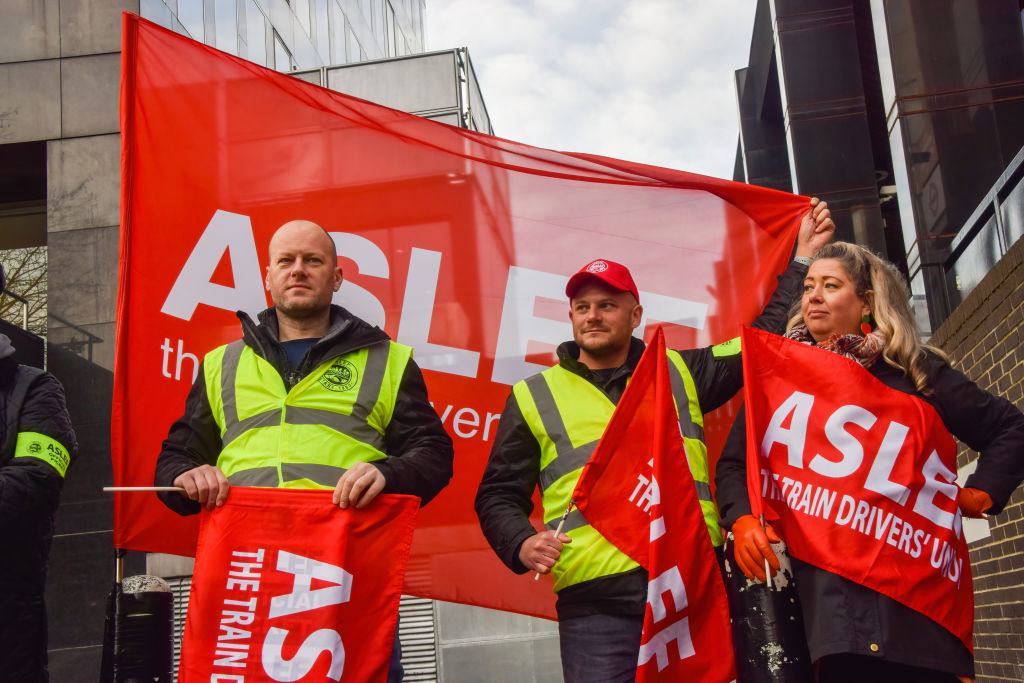 Aslef members picket outside Euston Station in London. Credit: Getty