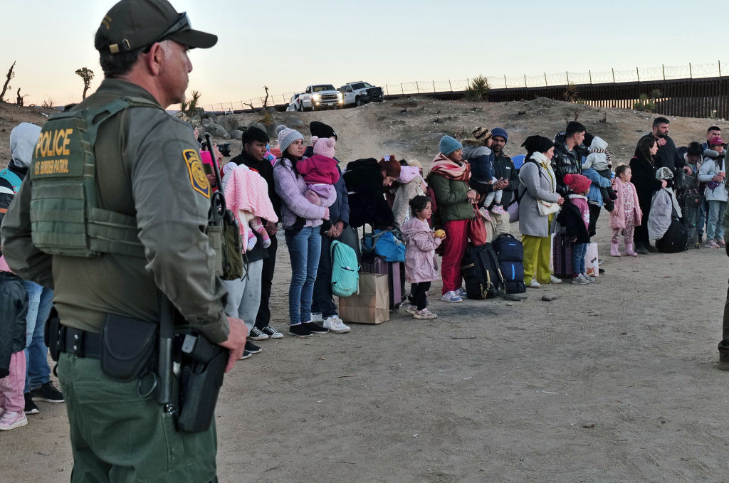 Migrants attempting to cross into the US from Mexico are detained by Customs and Border Protection officials at the border. Credit: Getty