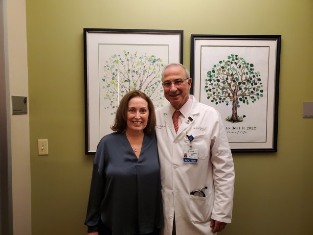 Allison Ducluzeau with her doctor after receiving treatment. 