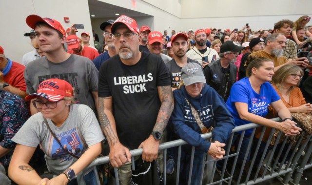 ERIE, PENNSYLVANIA - SEPTEMBER 29: Supporters listens to Republican presidential nominee, former President Donald Trump speak at a campaign rally at the Bayfront Convention Center on September 29, 2024 in Erie, Pennsylvania. Trump continues to campaign in battleground swing states ahead of the November 5 election. (Photo by Jeff Swensen/Getty Images)