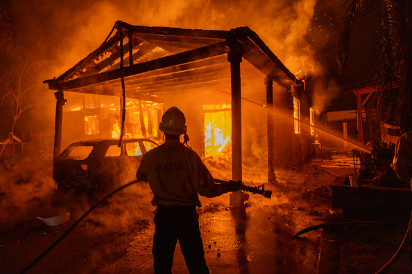 'My heart breaks for all that the people in these beautiful houses, the fruit of beautiful achievements, have been lost.' Photo by David McNew/Getty Images.