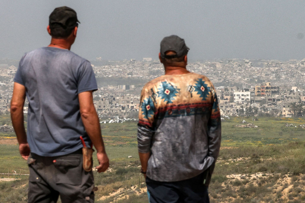 Residents of the Gaza Strip survey the damage caused by Israeli strikes on Tuesday. Credit: Getty