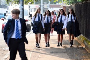Why do teenage girls feel unsafe in British schools?