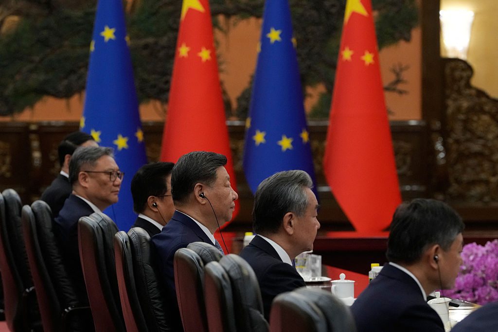 Xi Jinping and other members of the Chinese delegation at the meeting in Beijing today. Credit: Getty